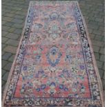 Washed red ground Persian runner 290cm by 113cm