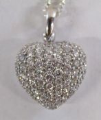 Tested as 18ct white gold hollow heart pendant set with 55 brilliant cut diamonds each stone approx.