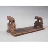 A Black Forest carved wood book slide with bear ends, 13" wide