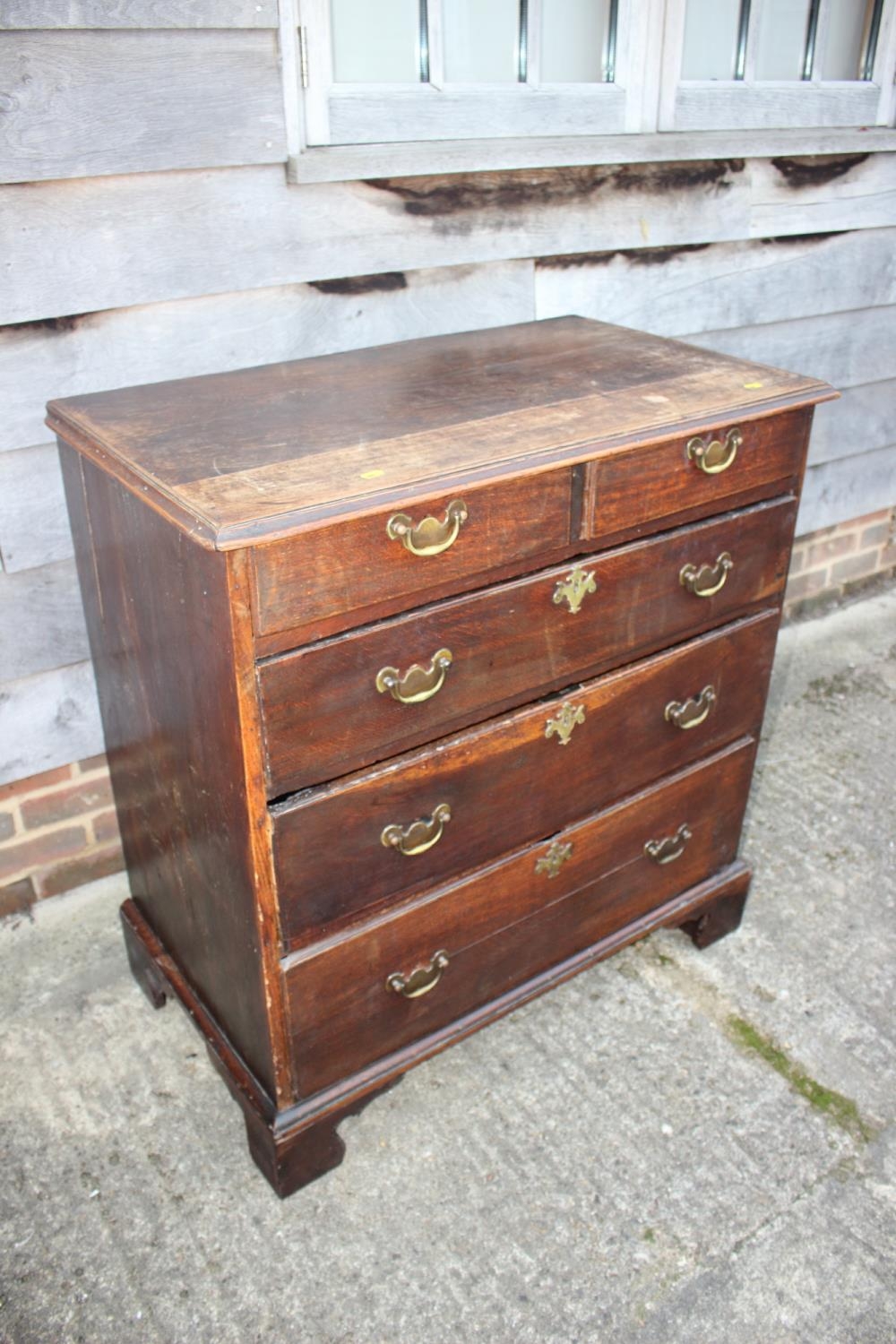 An 18th century oak chest of two short and three long graduated drawers with brass handles, on - Image 2 of 12