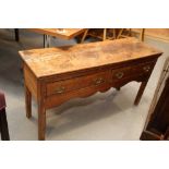 A 19th century waxed pine low side table, fitted two drawers, on square taper supports, 43 1/2" wide