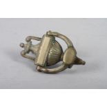 A brass door knocker of Neoclassical design