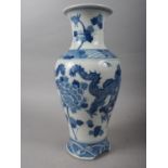 A 19th century Chinese blue and white baluster vase, decorated two dragons and flowers, 15 high (
