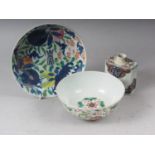 A Chinese famille rose bowl with floral and scrolled polychrome decoration and six character mark to