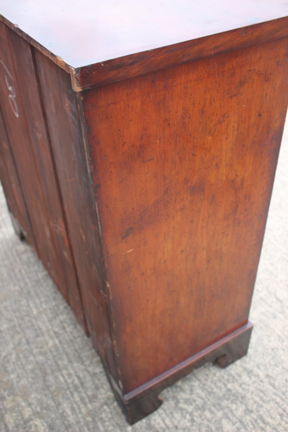 A 19th century figured mahogany chest of two short and three long graduated drawers with oval - Image 9 of 9