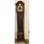 A 20th century oak long case clock with brass dial, silvered chapter ring and Westminster chime, 78"