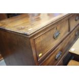 A 19th century mahogany chest of two short and three long graduated drawers with embossed oval brass