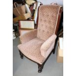 An Edwardian walnut showframe armchair, upholstered in a 1930s design geometric fabric, on turned