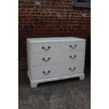 A 1930s white painted walnut and inlaid chest of two short and two long drawers with brass