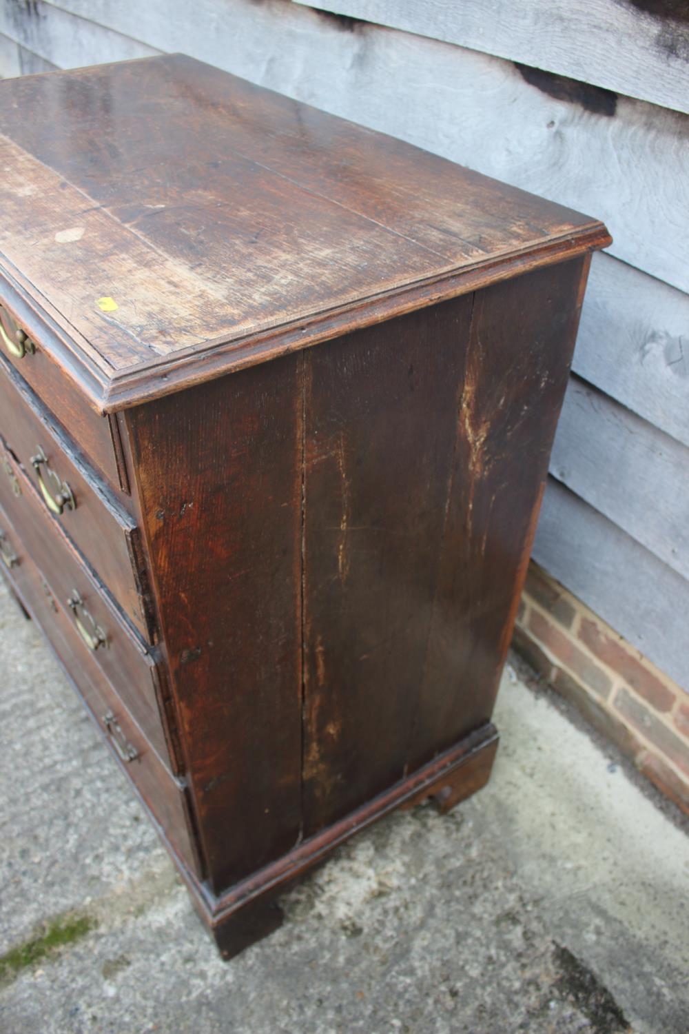 An 18th century oak chest of two short and three long graduated drawers with brass handles, on - Image 7 of 12