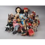 A quantity of mostly souvenir and tourist dolls and some porcelain figure busts