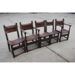 A set of five oak framed dining chairs of 17th century design with leather seats and backs, on