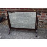 A 1930s mahogany rectangular swing frame toilet mirror, on splay supports, 26" wide x 22 1/2" high