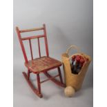 A doll's painted hardwood rocking chair, a child's wooden wheelbarrow and a set of six painted