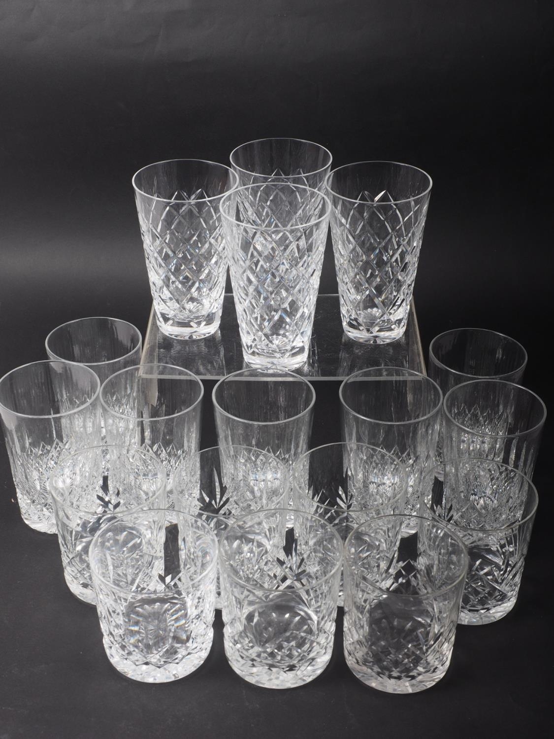 A set of four Waterford crystal tapered glasses, seven Webb tumblers and seven other tumblers