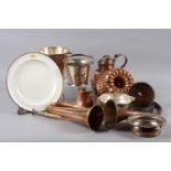 An assortment of metalware, including a pair of silver plated wine bottle coasters, a copper