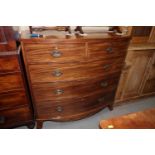 A 19th century mahogany bowfront chest of two short and three long graduated drawers with oval brass
