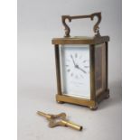 A Matthew Norman brass and glass cased carriage clock, 5" high