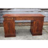 A 19th century mahogany ledge back double pedestal sideboard, fitted three drawers over cupboards,