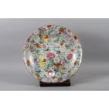 A 19th century Japanese porcelain "millefiori" charger, 16" dia (restored)