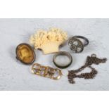 A 19th century carved ivory basket brooch, a micro mosaic ring, a jade ring, a pair of buckles, a