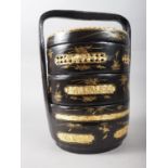 A Chinese black and gilt lacquered three-tier wedding basket, 12 1/2" high
