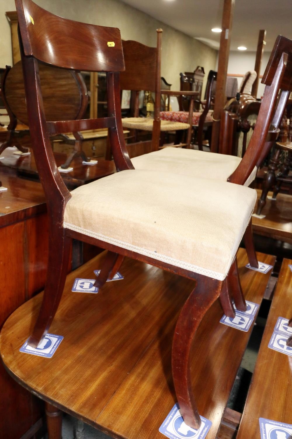 A matched set of four early 19th century mahogany bar back standard dining chairs with stuffed - Image 2 of 2