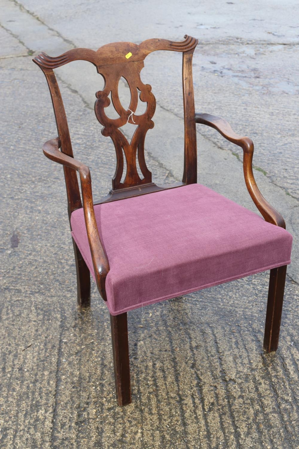 A Georgian mahogany carved dining chair with pierced splat back, Cupid bow top rail and stuffed over