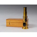 A brass portable microscope, in case, with three lenses, 6 1/4" high