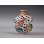 A Chinese porcelain pierced and relief decorated snuff bottle, no stopper, seal mark to base, 2 5/8"