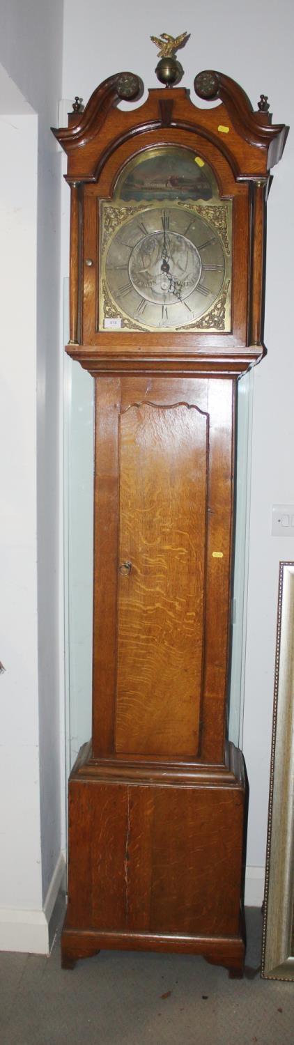 A late Georgian oak longcase clock with eight-day striking movement, brass and painted arch top dial