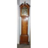 A late Georgian oak longcase clock with eight-day striking movement, brass and painted arch top dial