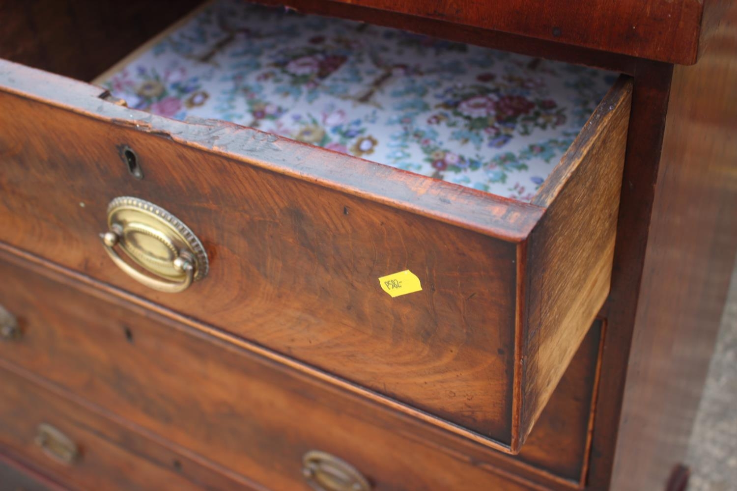A 19th century figured mahogany chest of two short and three long graduated drawers with oval - Image 3 of 9