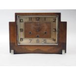An Art Deco walnut cased mantel clock with three train movement, 9" high