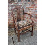 A Georgian provincial mahogany carver dining chair with drop-in needlepoint seat, on moulded