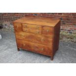 A Maples oak chest of two shallow, two deep and two long graduated drawers with brass ring