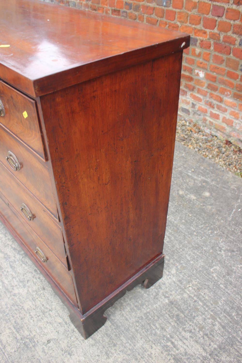 A 19th century figured mahogany chest of two short and three long graduated drawers with oval - Image 7 of 9