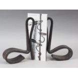 John Creed: wrought steel, a pair of scroll book ends, 11" high