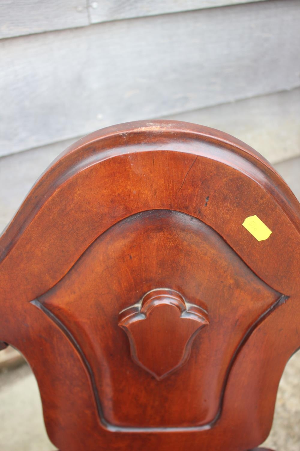 A pair of 19th century carved mahogany hall chairs with shaped panel backs, on turned supports - Image 3 of 6