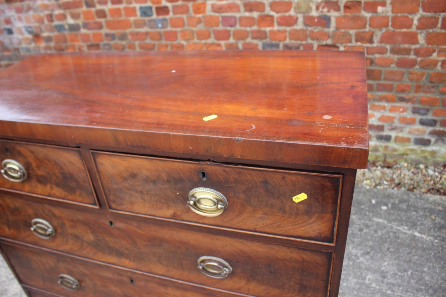 A 19th century figured mahogany chest of two short and three long graduated drawers with oval - Image 2 of 9