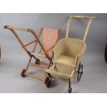 A doll's 1930s Lloyd Loom pram and a 1930s folding pram with canvas seat