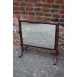 A 19th century mahogany swing frame toilet mirror, on faux bamboo turned splay supports, 20" wide