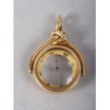 An 18ct gold fob swivel inset compass, 14.5g gross