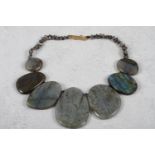 A labradorite oval disk necklace with yellow metal hook clasp, 18" long