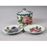 A Wemyss ware cabbage rose decorated biscuit barrel and cover and two fruit decorated biscuit