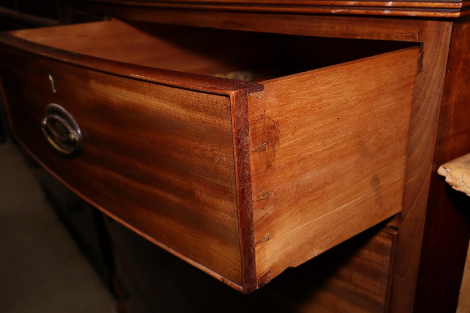 A 19th century mahogany bowfront chest of two short and three long graduated drawers with oval brass - Image 2 of 2