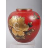 A red lacquered brass ginger jar with gilt flower and bird decoration, 5 1/2" high
