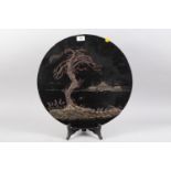 A Japanese circular lacquered landscape panel, 18" dia