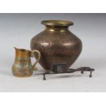 An Indian engraved brass and copper water pot, 5 1/2" high, a similar jug and a pair of 19th century