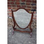 A Sheraton Revival mahogany and line inlaid shield-shaped swing frame toilet mirror, 16" wide x